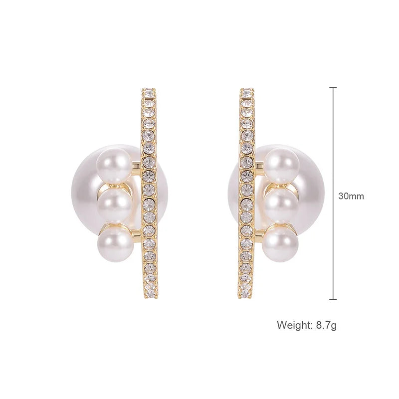 Pearl and crystal earrings with measurement details on a white background