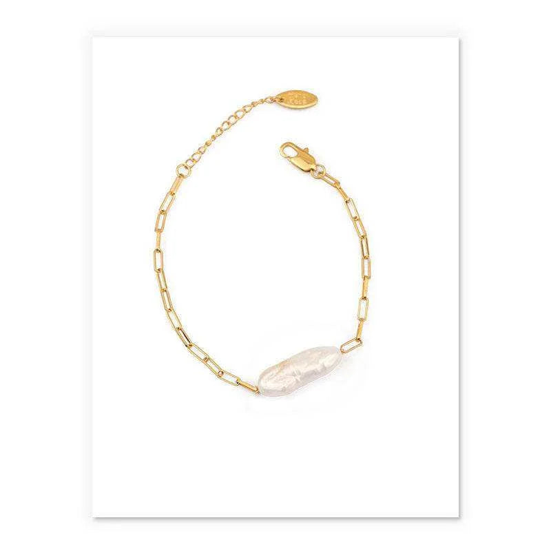 Gold bracelet with a pearl on a white background