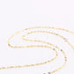 Gold necklace on a white background