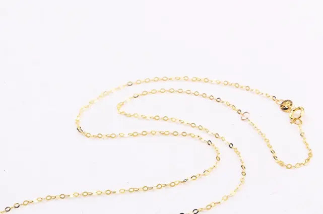 Gold necklace on a white background