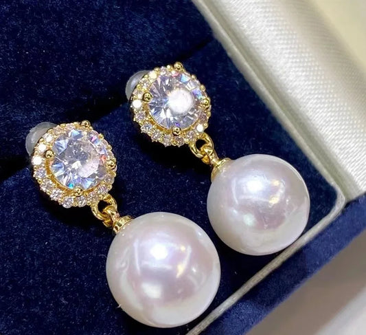 Pearl and crystal earrings in a jewelry box
