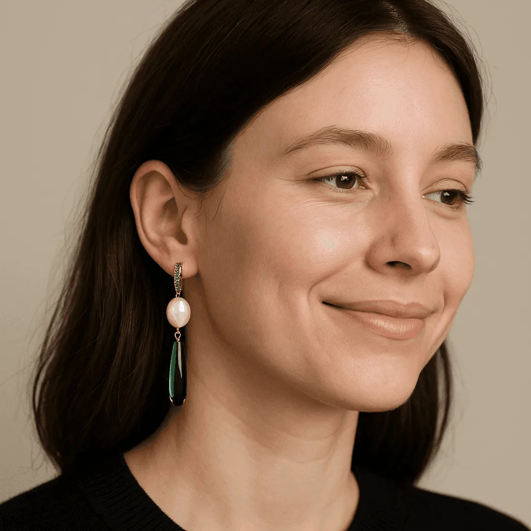 Close-up of a woman wearing earrings with a neutral background