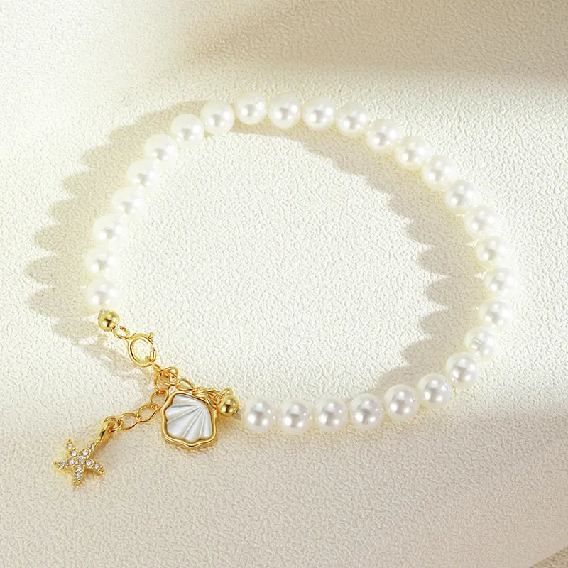 Gold Plated Pearl Bracelet with Coastal Charms